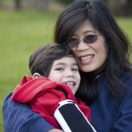 Woman hugging child