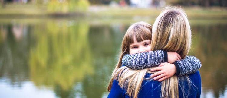 mother and daughter hugging