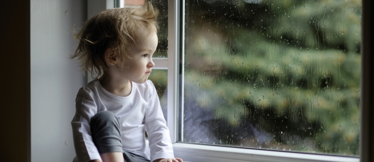 girl sitting by window