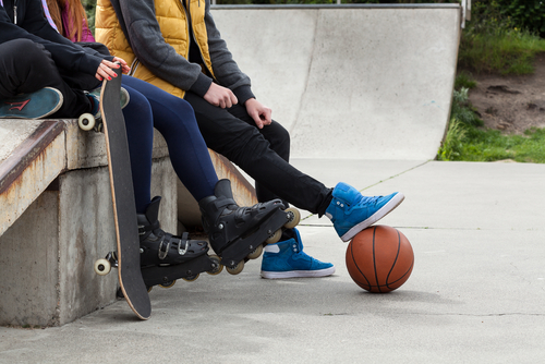 teens hanging out at skate park