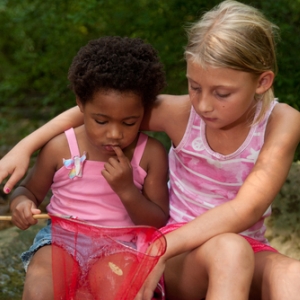 two girls exploring nature